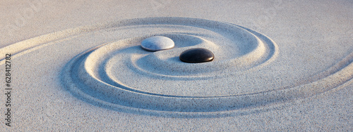 Yin Yang symbol. Motive made of stones and lines in the sand - 3D illustration