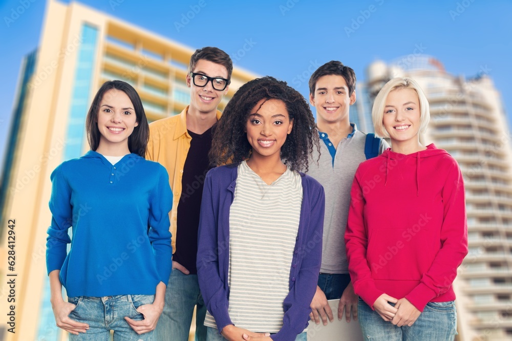 Happy young students friends talking together Happy young students friends talking together