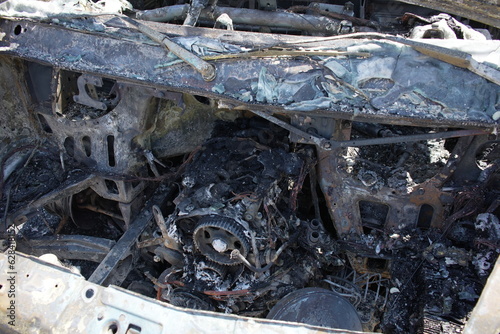 Burned car motor after fire  photo