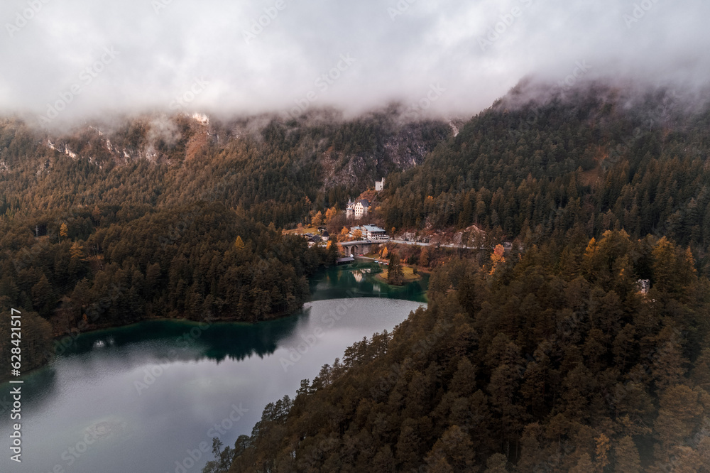 Moody Aerial photo of Fernsteinsee lake in Austria in autumn season 