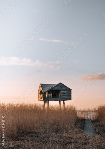 Sunset photo of Kiekkaaste Bird Observatory in The Netherlands at Wadden Sea photo