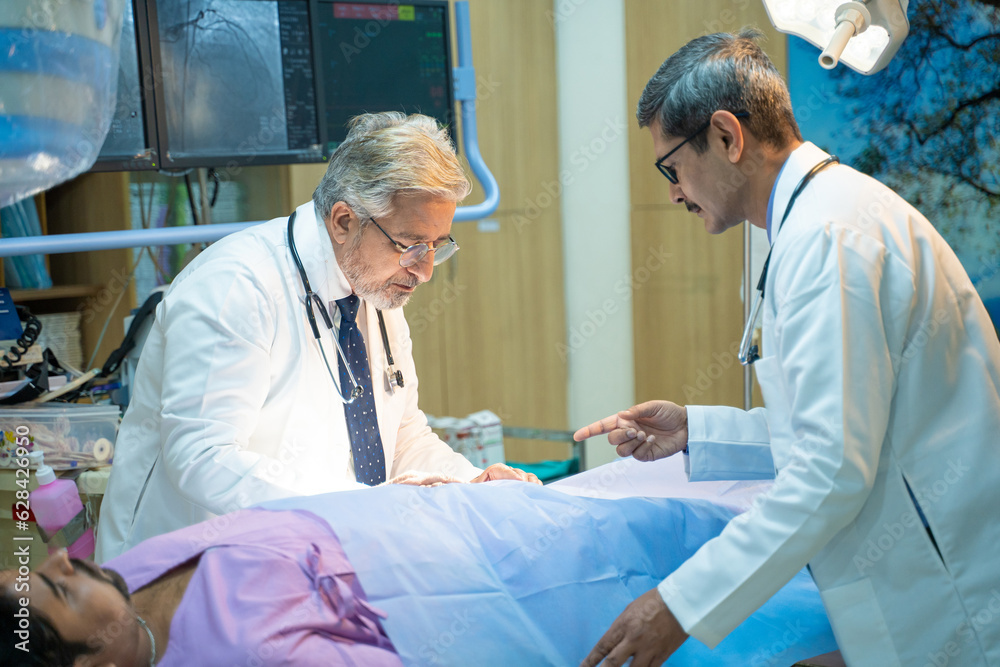 Obraz premium Doctors Performing Surgical Operation in Bright Modern Operating Room