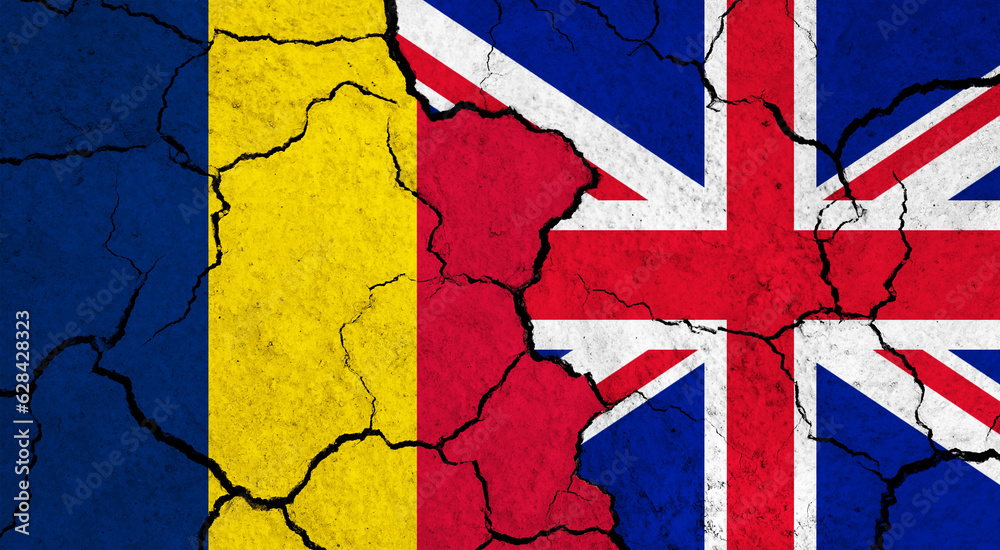 Fototapeta premium Flags of Chad and United Kingdom on cracked surface - politics, relationship concept