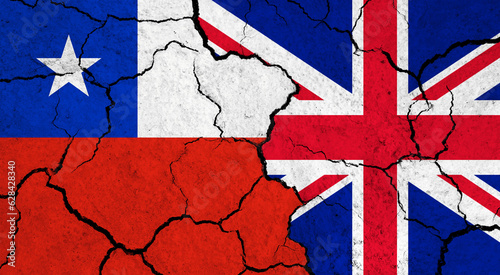 Flags of Chile and United Kingdom on cracked surface - politics, relationship concept