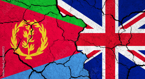 Flags of Eritrea and United Kingdom on cracked surface - politics, relationship concept