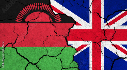 Flags of Malawi and United Kingdom on cracked surface - politics, relationship concept