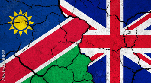 Flags of Namibia and United Kingdom on cracked surface - politics, relationship concept