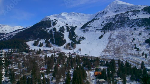 Beautiful view of mountains skiers and slopes at the Alyeska Resort in Girdwood Alaska. 4k drone. photo