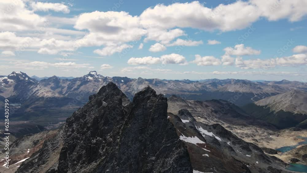 Two mountaineers on the top of a mountain in patagonia Two mountaineers on the top of a mountain in patagonia