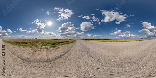 360 hdri panorama on white sand gravel road with clouds on blue sky in equirectangular spherical seamless projection, skydome replacement in drone panoramas, game development sky dome or VR content