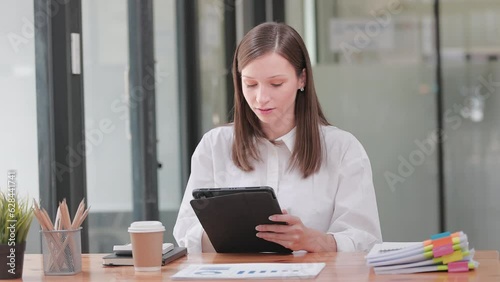 Young Happy Beautiful Businesswoman Working in Modern Office. Beautiful Manager Smiling, Working on Financial, Marketing Projects Operations, Analysing Statistics, Commerce Data, Marketing Plans. 
