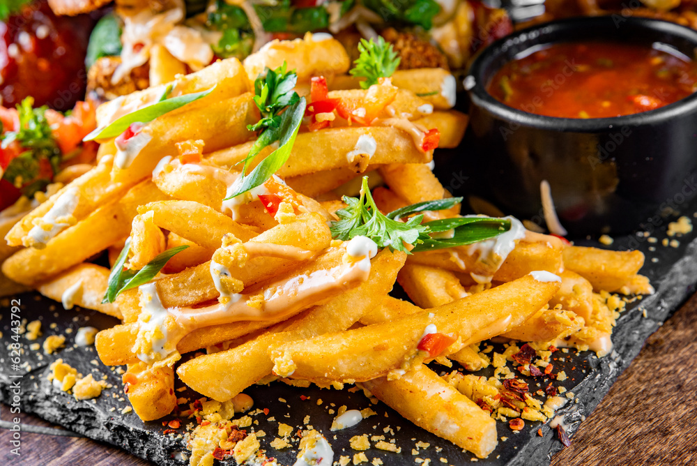 French fries with sauce on plate French fries with sauce on plate
