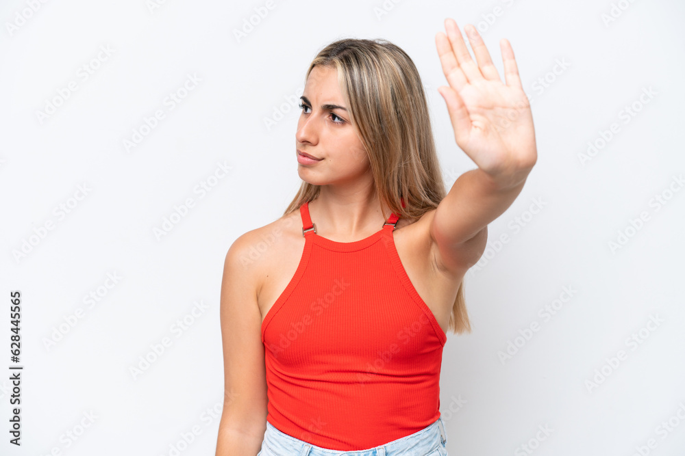 Young caucasian woman isolated on white background making stop gesture and disappointed Young caucasian woman isolated on white background making stop gesture and disappointed