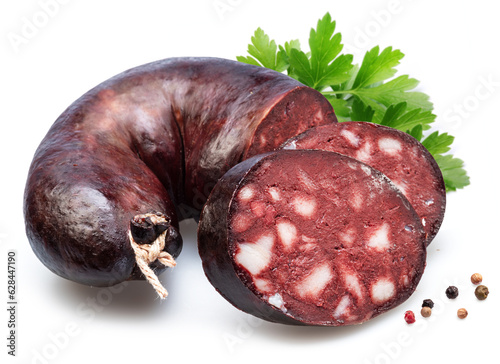 Blood sausage with suet pieces and parsley leaf isolated on white background. photo