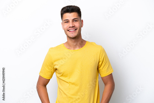 Young caucasian man isolated on white background laughing