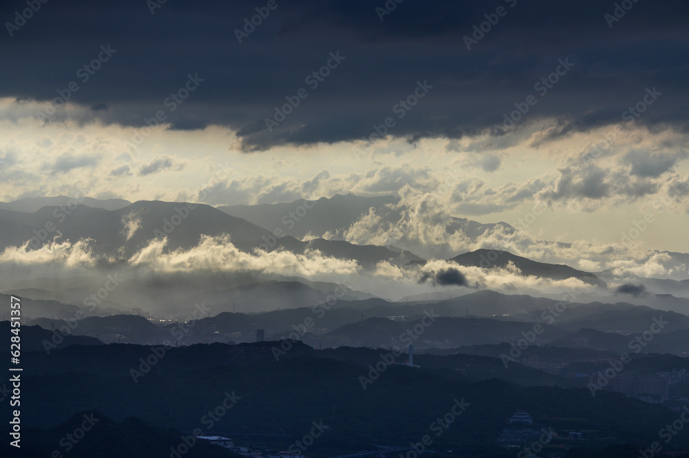 Above the cascading mountains, there are crepuscular light and dynamic clouds. Wufen Mountain in Pingxi was photographed from Buyanting Pavilion. Taiwan Above the cascading mountains, there are crepuscular light and dynamic clouds. Wufen Mountain in Pingxi was photographed from Buyanting Pavilion. Taiwan