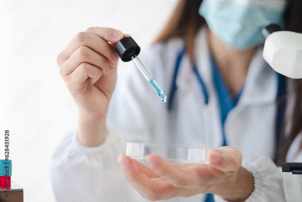 Science and medicine, scientist analyzing and dropping a sample into a glassware, experiments containing chemical liquid in laboratory on glassware, innovative and technology. Science and medicine, scientist analyzing and dropping a sample into a glassware, experiments containing chemical liquid in laboratory on glassware, innovative and technology.