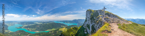 landscape with top of Mount Schafberg with cross and mountains and Lake Mondsee and Attersee, Alps, Austria photo