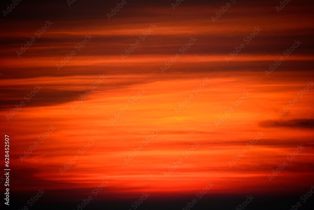 At dusk, orange sky and black clouds. Abstract background. View of the urban landscape from Dajianshan Mountain, New Taipei City.