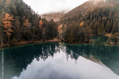 Moody Aerial photo of Fernsteinsee lake in Austria in autumn season  photo