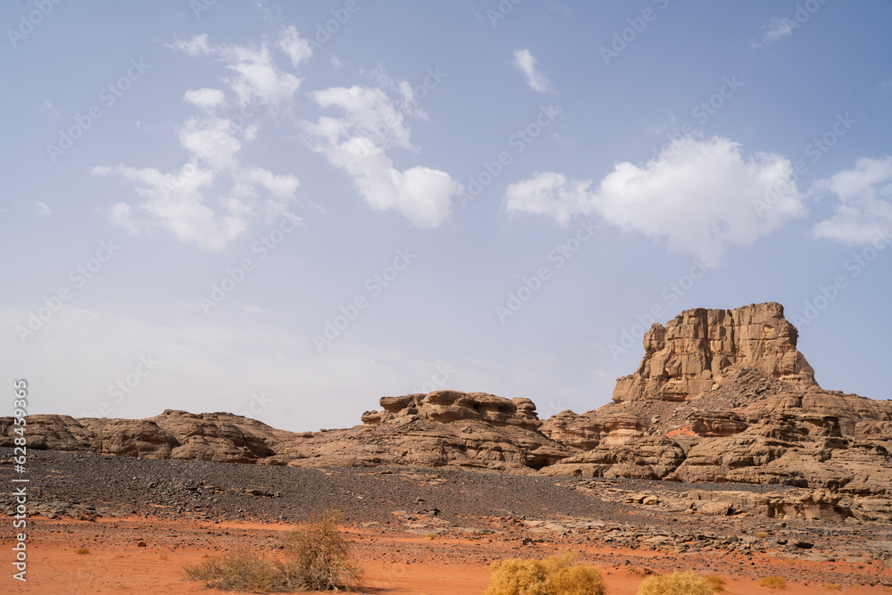 iew in the Sahara desert of Tadrart rouge tassili najer in Djanet City ,Algeria.colorful orange sand, rocky mountains iew in the Sahara desert of Tadrart rouge tassili najer in Djanet City ,Algeria.colorful orange sand, rocky mountains