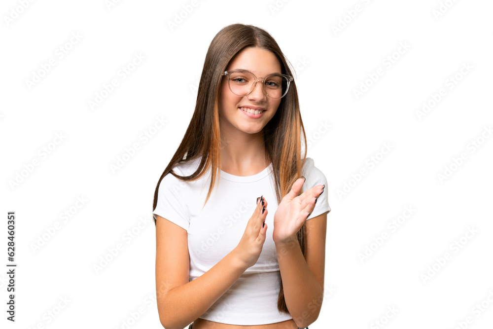 Teenager caucasian girl over isolated background applauding after presentation in a conference Teenager caucasian girl over isolated background applauding after presentation in a conference