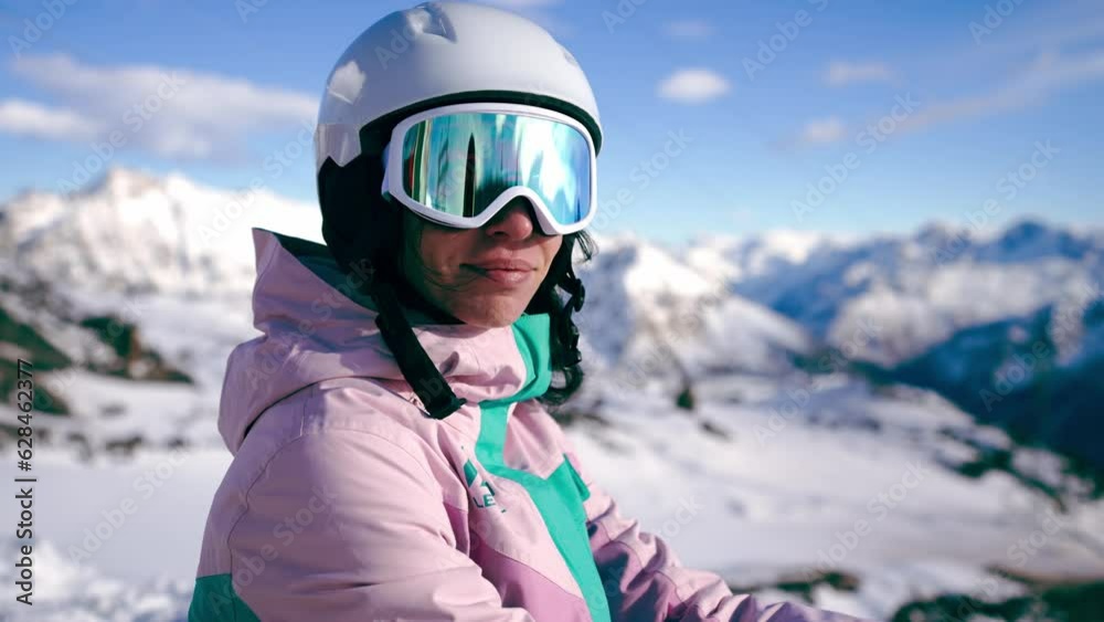 Close-up portrait of woman snowboarder skyer in ski helmet and glasses in mountains, side view. Girl wearing in ski clothes in winter resort. Enjoy healthy sport active rest, snowboarding lifestyle. Close-up portrait of woman snowboarder skyer in ski helmet and glasses in mountains, side view. Girl wearing in ski clothes in winter resort. Enjoy healthy sport active rest, snowboarding lifestyle.