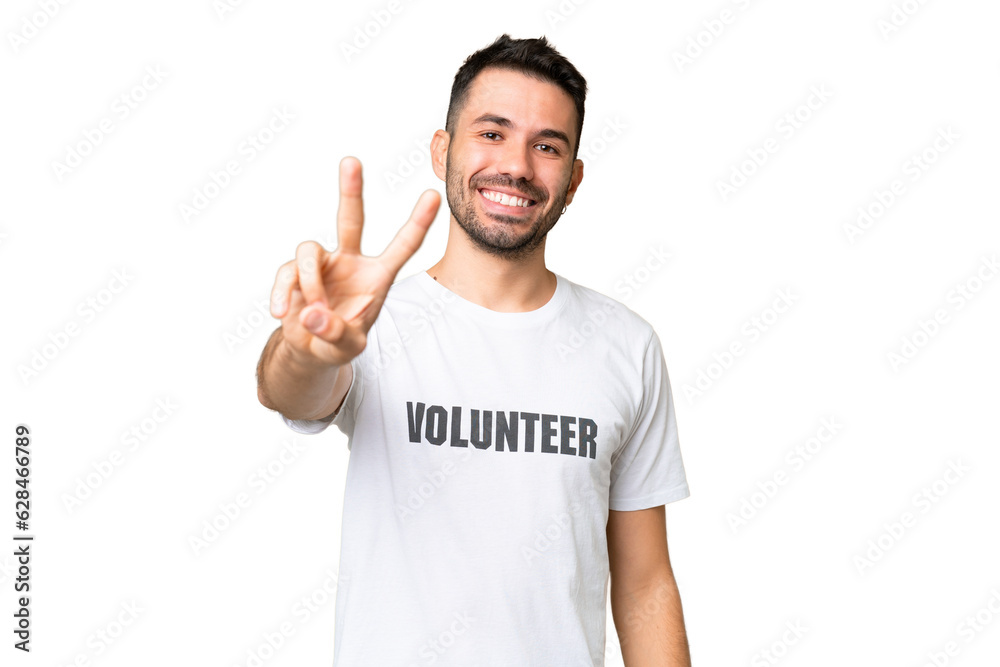 Young volunteer caucasian man over isolated chroma key background smiling and showing victory sign Young volunteer caucasian man over isolated chroma key background smiling and showing victory sign