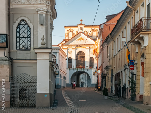 Vilnius, Lithuania - 07 15 2023: Aušros vartai. Gate of Dawn. City gate in Vilnius, one of most important religious, historical and cultural monuments.