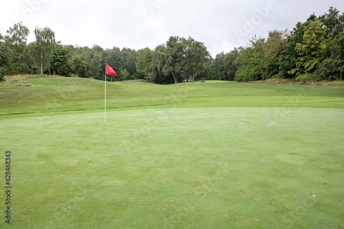 golf course with flag at the green