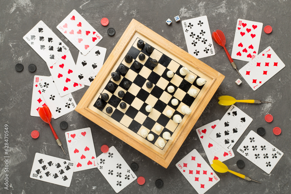 Different board games on concrete background, top view Different board games on concrete background, top view