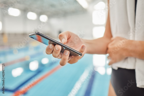 Phone  hands and athlete at swimming pool with social media  scrolling online or browsing internet after exercise. Swim  sports and person with cellphone for communication after workout or training