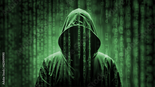 Obraz w ramie Hacker under a matrix digital rain, mysterious hooded man silhouette under a green binary code characters falling down, computer technology concept for coding, hacking or cyber security