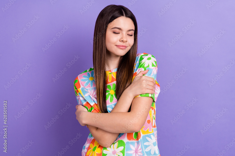 Portrait of adorable person with straight hairdo wear stylish t-shirt hug herself smell clothes isolated on purple color background Portrait of adorable person with straight hairdo wear stylish t-shirt hug herself smell clothes isolated on purple color background