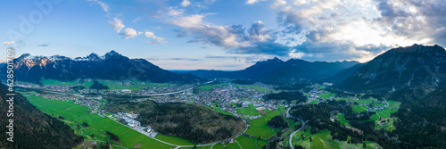 panorama from the valley of the reutte-ausserfern holiday region with a view of the hahnenkamm and tauern mountains