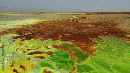 Journey to the Danakil Desert, Ethiopia. The colorful landscape of Dallol lake in Crater of Volcano. Sulphur springs. Hottest place on the Earth. Acid lake, Danakil desert by drone.