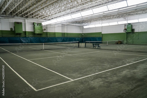 Indoor tennis court with artificial turf