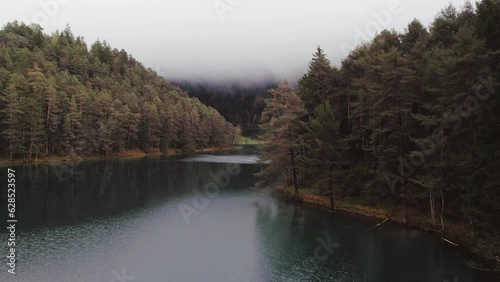 Moody Aerial video of Fernsteinsee lake in Austria in autumn season  photo