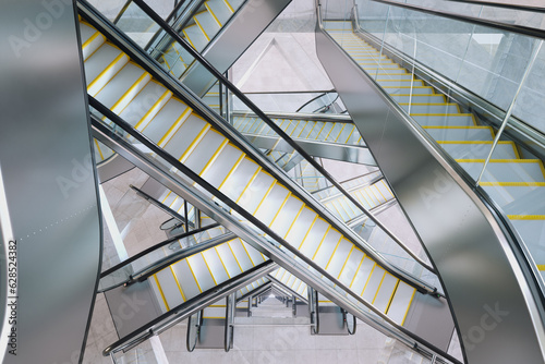 Tableau sur toile Puzzling labyrinth of escalators made of glass and steel