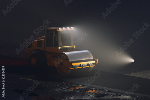 The big yellow roller on the asphalt road at night. Huge vehicle ready to work.