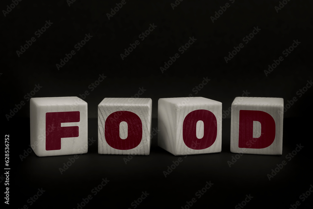Word FOOD written with wooden cubes. Studio shot of some arranged wooden blocks with a testual message about disinformation. Word FOOD written with wooden cubes. Studio shot of some arranged wooden blocks with a testual message about disinformation.