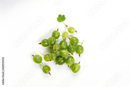 Green ripe gooseberries on a white background top view.