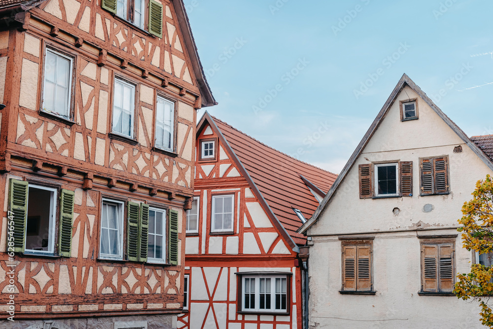 Obraz premium The Old Fachwerk houses in Germany. Scenic view of ancient medieval urban street architecture with half-timbered houses in the Old Town of Germany.