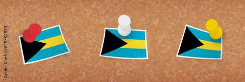 The Bahamas flag pinned in cork board, three versions of The Bahamas flag.