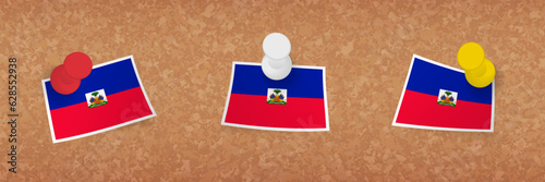 Haiti flag pinned in cork board, three versions of Haiti flag.