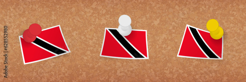 Trinidad and Tobago flag pinned in cork board, three versions of Trinidad and Tobago flag.