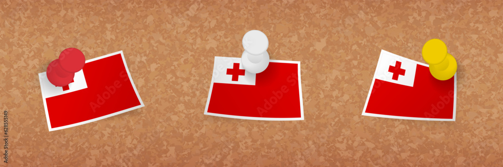 Tonga flag pinned in cork board, three versions of Tonga flag. Tonga flag pinned in cork board, three versions of Tonga flag.