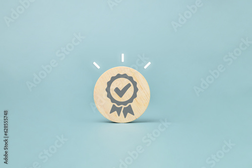 Certificate guarantee icon on wooden cube, International Organization for Standardization ISO and quality control certification concept, Sign of top service quality assurance