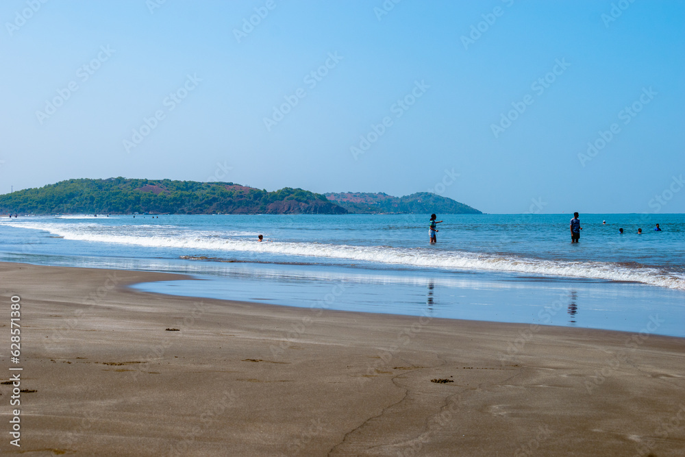 Unidentified people enjoying on the beach at Goa, India