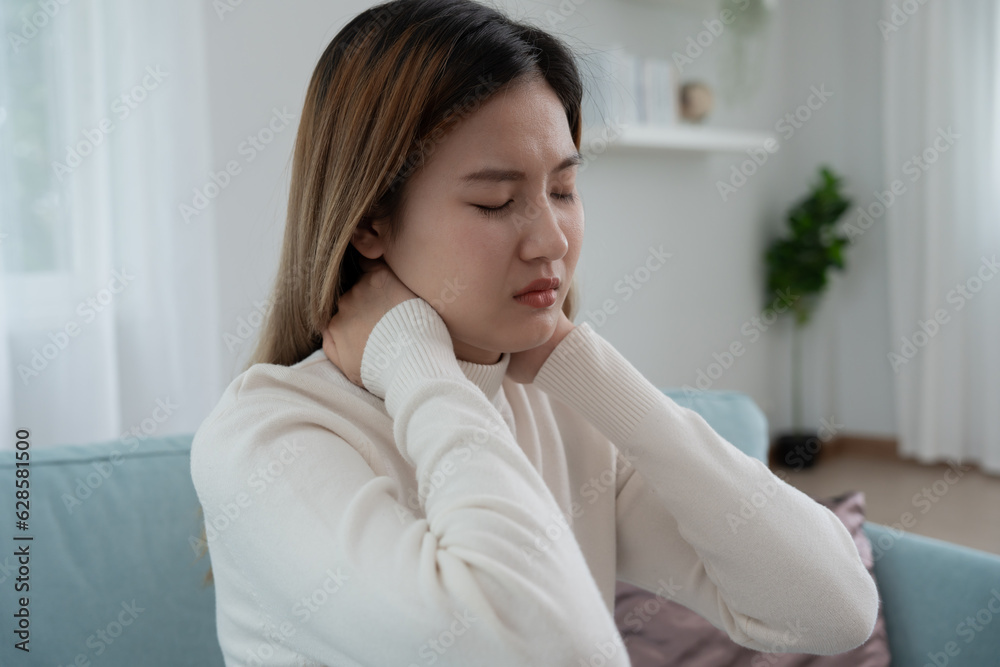 office syndromes, woman massaging neck pain due to work and using a computer, digital composite of a focused spine of neck pain and shoulder pain symptoms , injuries, health care, medical, myositis office syndromes, woman massaging neck pain due to work and using a computer, digital composite of a focused spine of neck pain and shoulder pain symptoms , injuries, health care, medical, myositis